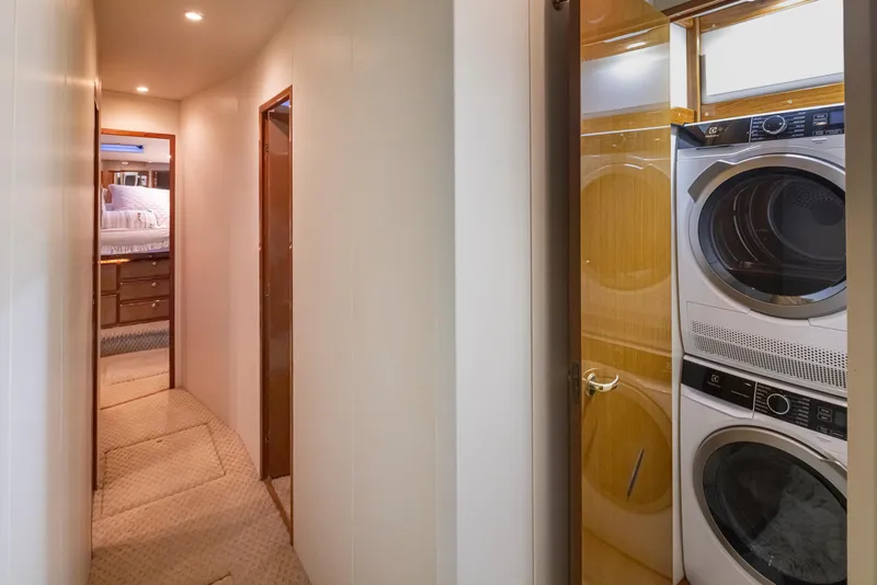 Slide: The Image of Hallway in 2000 Viking 72 Convertible yacht with washer and dryer. - 31