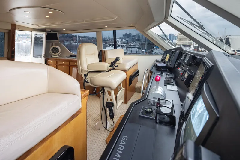 Slide: The Image of Interior of 2000 Viking 72 Convertible yacht with helm station and seating. - 33
