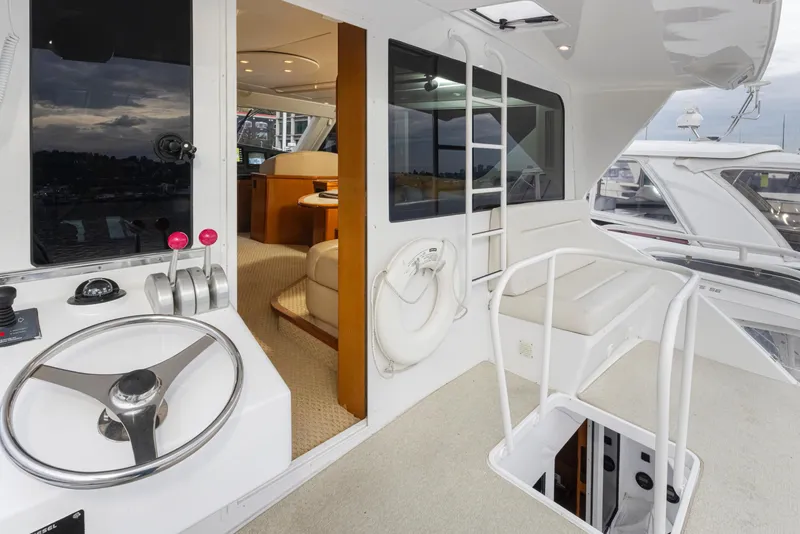 Slide: The Image of Viking 72 Convertible 2000 yacht interior and helm station with modern amenities. - 36