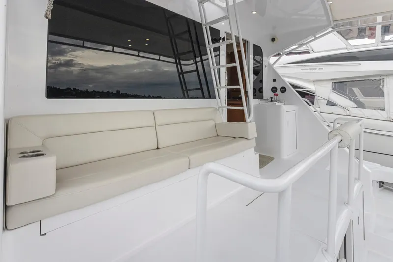 Slide: The Image of Viking 72 Convertible 2000 yacht with white seating and ladder. - 37