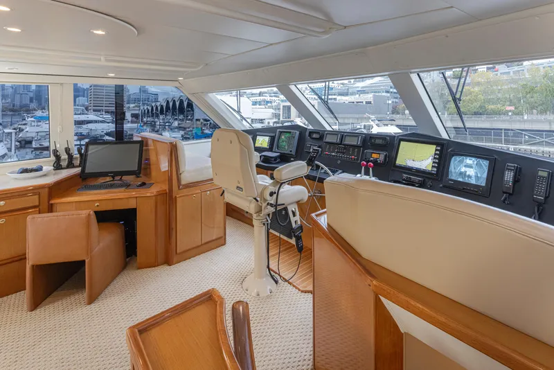 Slide: The Image of Viking 72 Convertible 2000 yacht helm station with navigation equipment and panoramic windows. - 4
