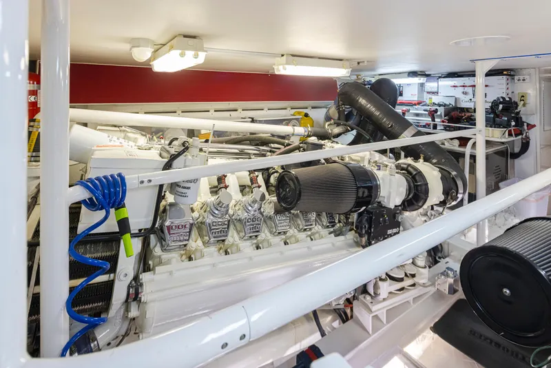 Slide: The Image of Engine room of a 2000 Viking 72 Convertible yacht with visible machinery. - 50