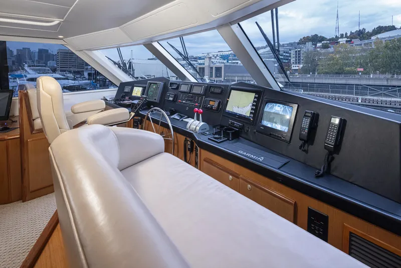 Slide: The Image of Helm station of a 2000 Viking 72 Convertible yacht with advanced navigation equipment. - 6