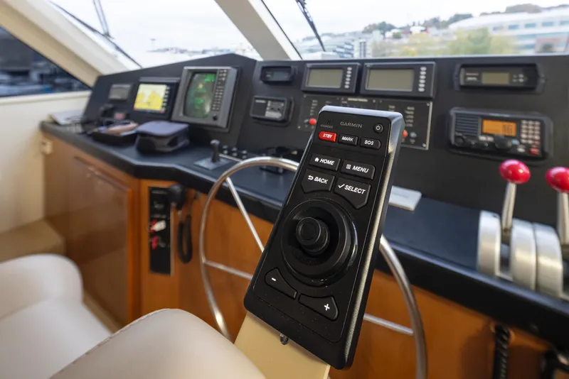 Slide: The Image of Control panel of a 2000 Viking 72 Convertible yacht with navigation equipment. - 8