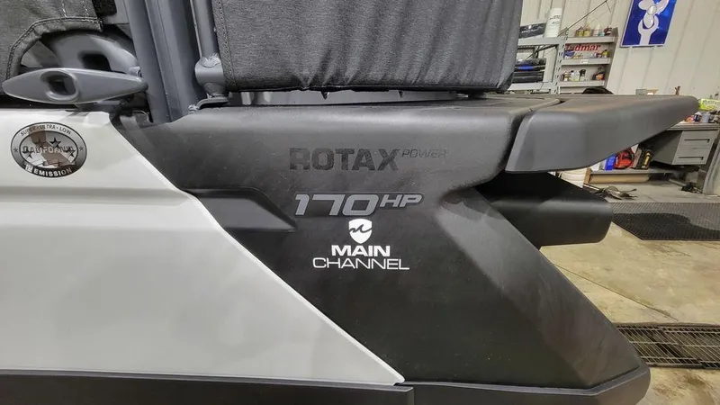 Slide: The Image of 2023 Sea-Doo Switch® Cruise 18-170 hp, Rotax engine, in a workshop. - 11