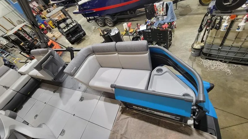 Slide: The Image of 2023 Sea-Doo Switch® Cruise 18-170 hp interior seating in a workshop. - 4