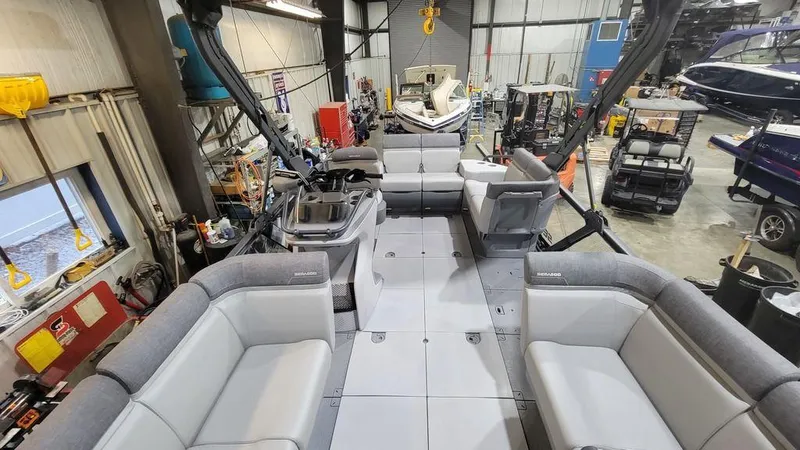 Slide: The Image of 2023 Sea-Doo Switch® Cruise 18-170 hp interior in a workshop. - 5