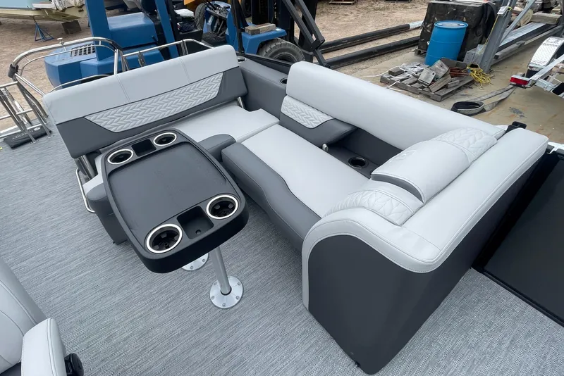 Slide: The Image of 2023 Godfrey Monaco 235 SFL boat interior with gray seating and cup holders. - 11