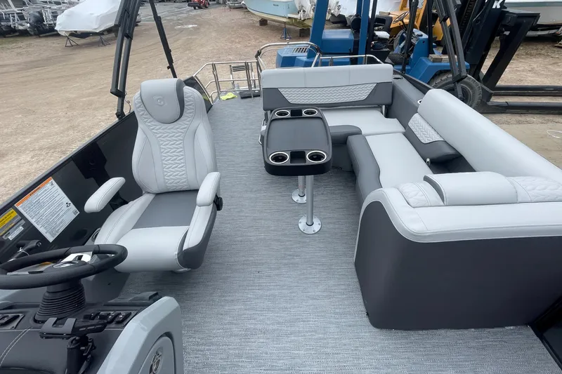 Slide: The Image of 2023 Godfrey Monaco 235 SFL boat interior with seating and table. - 12