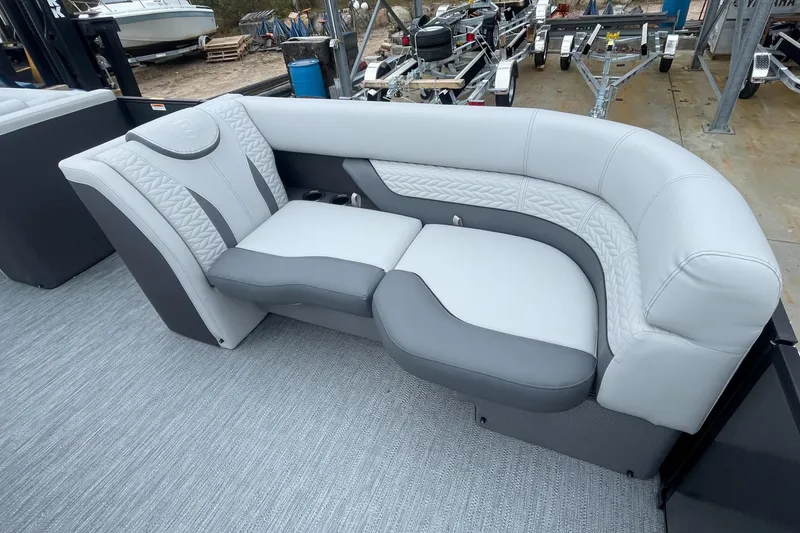 Slide: The Image of 2023 Godfrey Monaco 235 SFL boat interior with luxurious gray and white seating. - 17