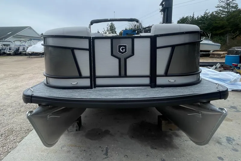 Slide: The Image of 2023 Godfrey Monaco 235 SFL pontoon boat front view in a boatyard. - 3