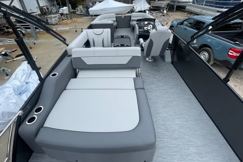 Slide: The Image of 2023 Godfrey Monaco 235 SFL pontoon boat interior with gray seating and modern design. - 9