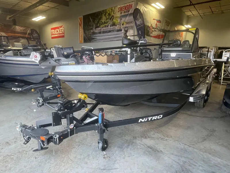 Slide: The Image of 2024 Nitro ZV20 Pro fishing boat in showroom, front view. - 1