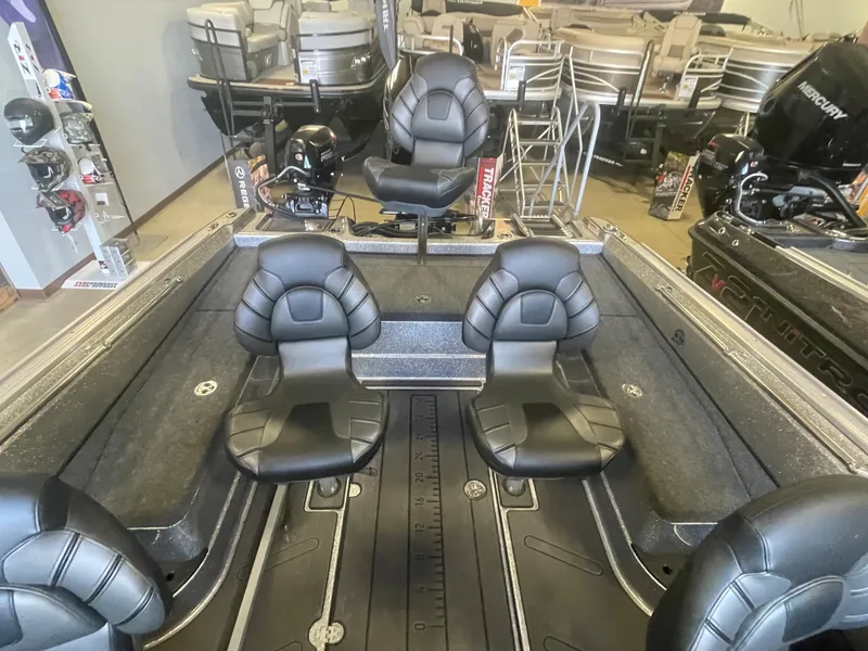 Slide: The Image of 2024 Nitro ZV20 Pro fishing boat interior with three black seats. - 10