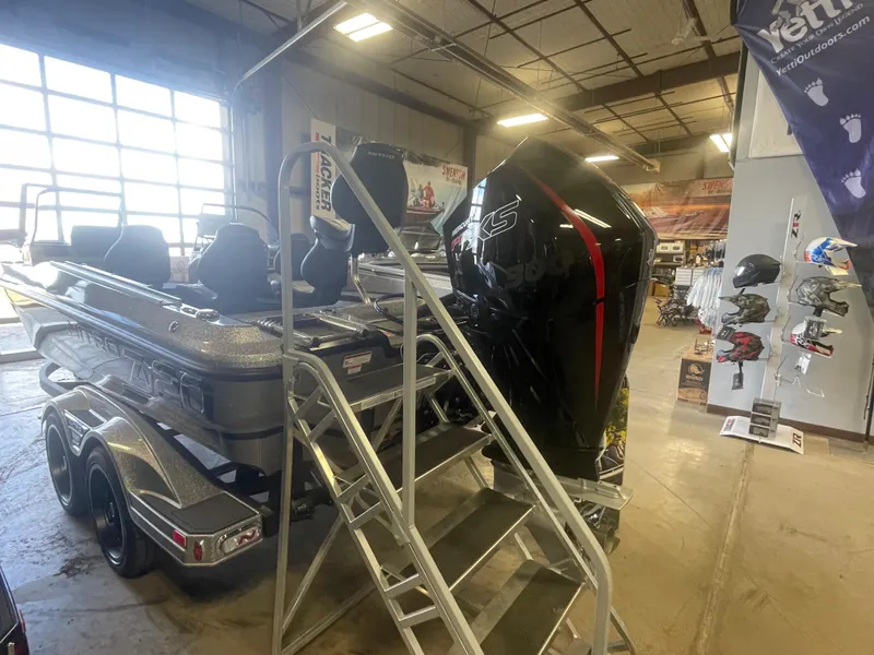 Slide: The Image of 2024 Nitro ZV20 Pro boat with outboard motor in showroom. - 5