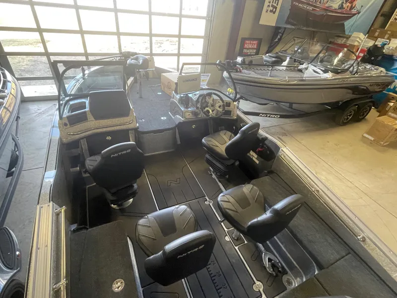 Slide: The Image of 2024 Nitro ZV20 Pro fishing boat interior in showroom. - 6