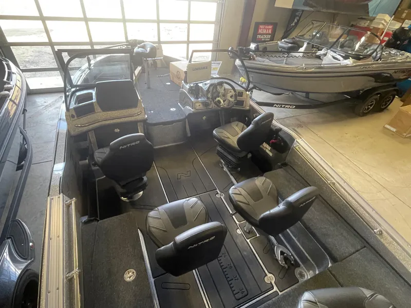 Slide: The Image of 2024 Nitro ZV20 Pro fishing boat interior with seating and control console. - 7