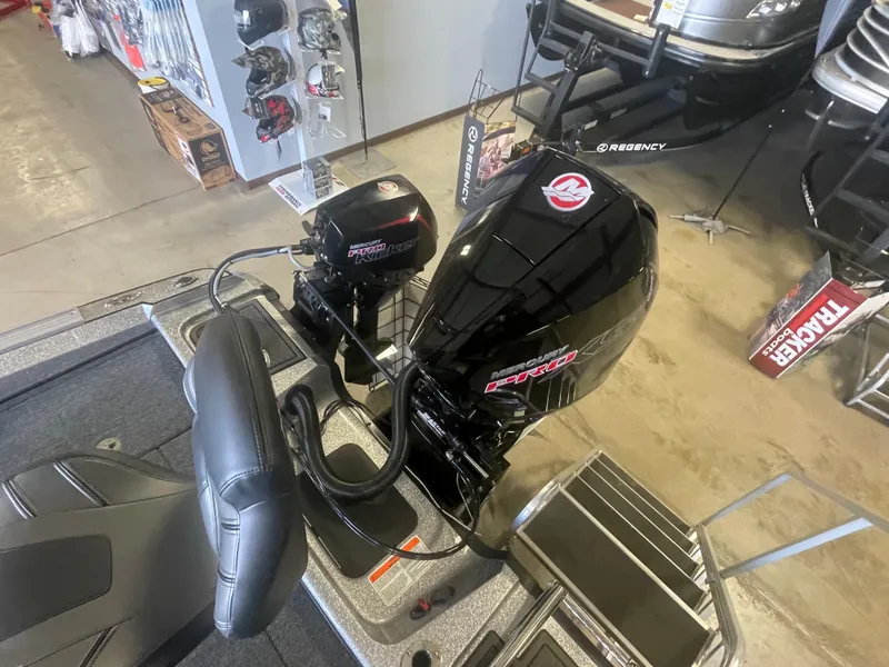 Slide: The Image of 2024 Nitro ZV20 Pro boat with dual Mercury outboard motors in showroom. - 9