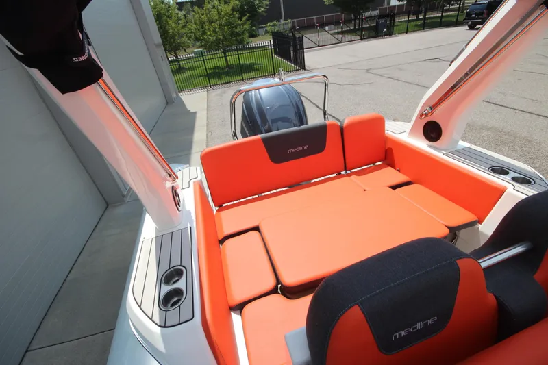 Slide: The Image of 2024 Zodiac Medline 7.5 NEO boat with vibrant orange seating and sleek design. - 11