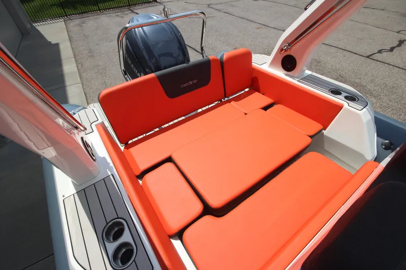 Slide: The Image of 2024 Zodiac Medline 7.5 NEO boat with vibrant orange seating and sleek design. - 12
