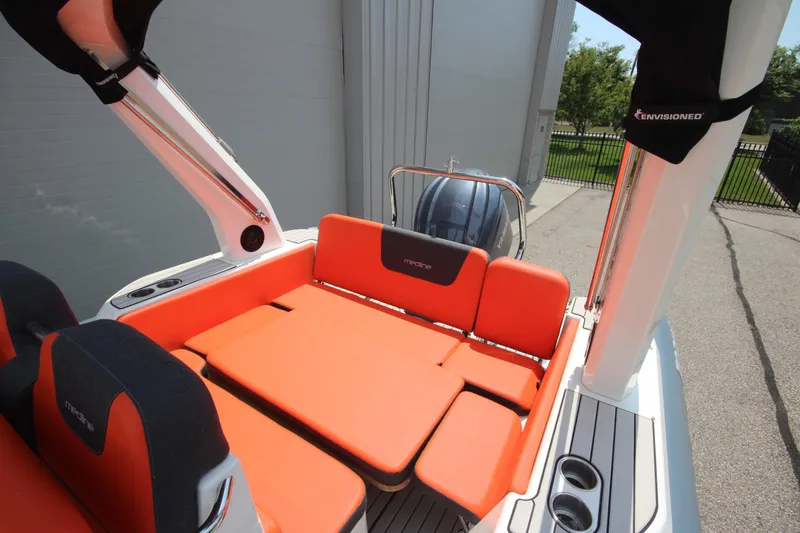 Slide: The Image of 2024 Zodiac Medline 7.5 NEO boat with orange seating, outdoor view. - 13