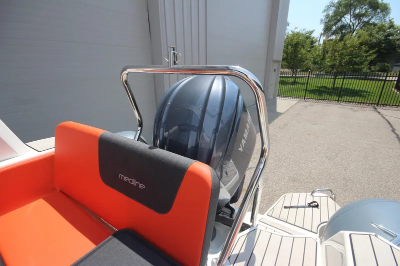 Slide: The Image of 2024 Zodiac Medline 7.5 NEO boat with Yamaha engine, orange seating, and sleek design. - 18