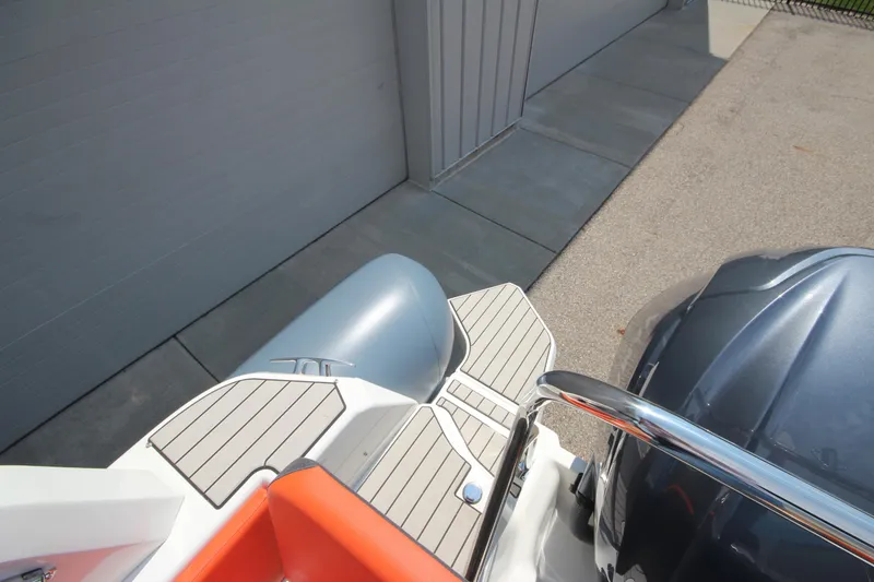 Slide: The Image of 2024 Zodiac Medline 7.5 NEO boat with 300hp engine, docked on concrete. - 19