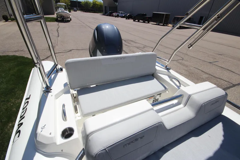 Slide: The Image of 2025 Zodiac Medline 5.8 NEO boat with 115hp engine, rear seating view. - 12