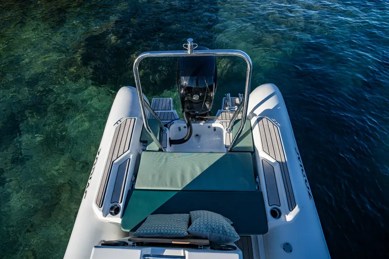 Slide: The Image of 2025 Zodiac Medline 5.8 NEO boat on clear water, featuring a sleek design and comfortable seating. - 31