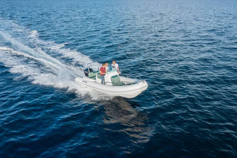 Slide: The Image of 2025 Zodiac Medline 5.8 NEO boat cruising on open water. - 35