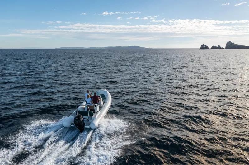 Slide: The Image of 2025 Zodiac Medline 5.8 NEO boat cruising on open sea under clear sky. - 36