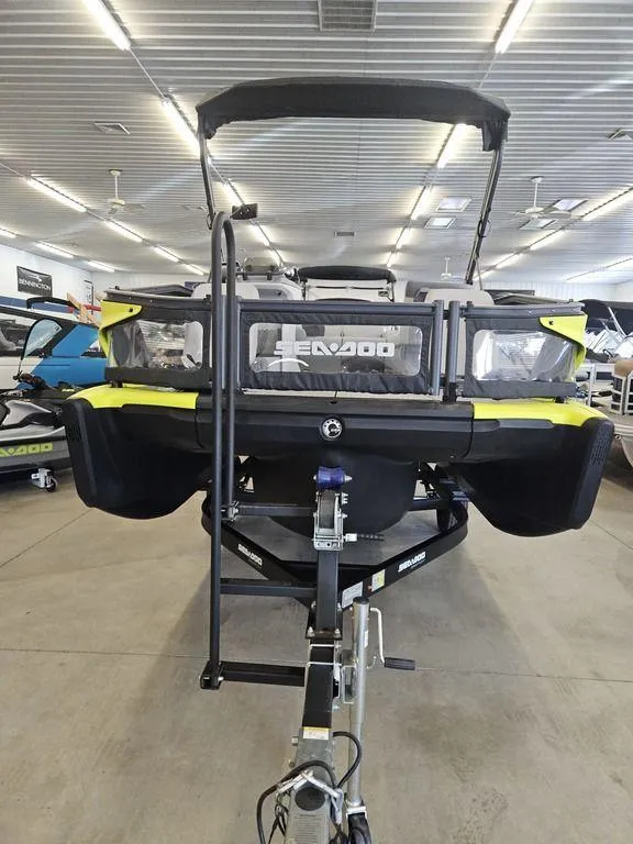 Slide: The Image of 2023 Sea-Doo Switch Sport 18-230 hp boat displayed in a showroom. - 10