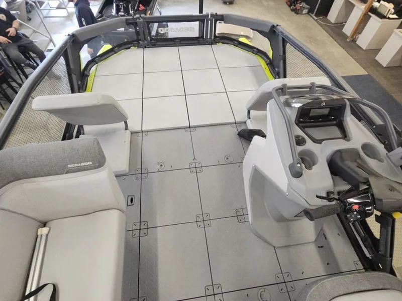 Slide: The Image of 2023 Sea-Doo Switch Sport 18-230 hp boat interior with seating and control console. - 4
