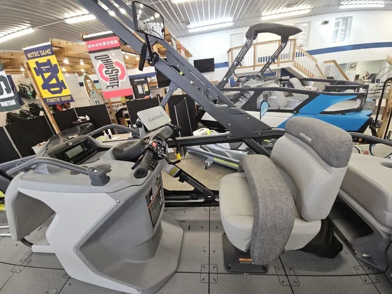 Slide: The Image of 2023 Sea-Doo Switch Sport 18-230 hp boat interior with steering console and seating. - 6