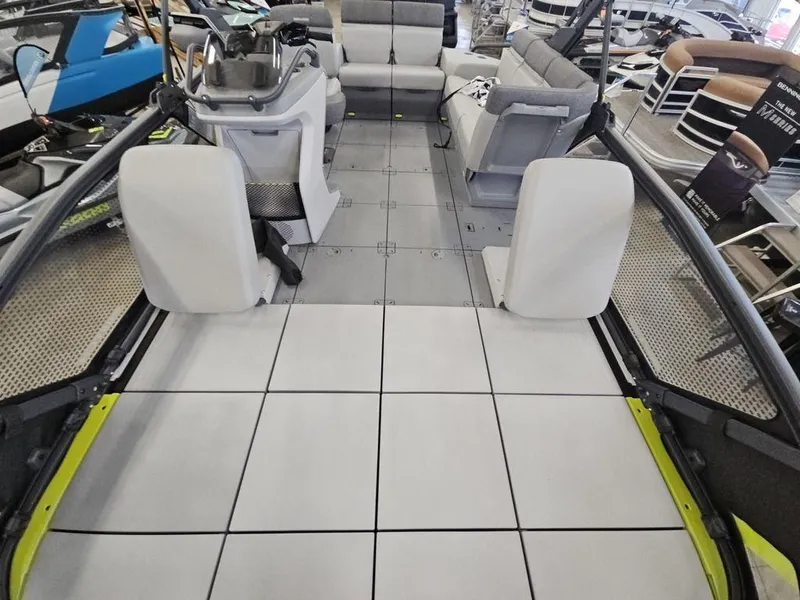 Slide: The Image of 2023 Sea-Doo Switch Sport 18-230 hp boat interior with spacious seating and modern design. - 7