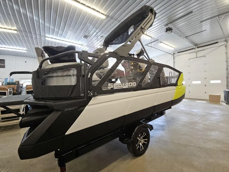 Slide: The Image of 2023 Sea-Doo Switch Sport 18-230 hp boat in a garage setting. - 8