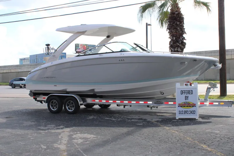 The Image of 2024 Regal LS9 Surf boat on a trailer, offered by South Austin Marine. - 1