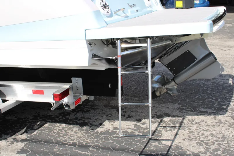 Slide: The Image of 2024 Regal LS9 Surf boat stern with ladder and propeller. - 11
