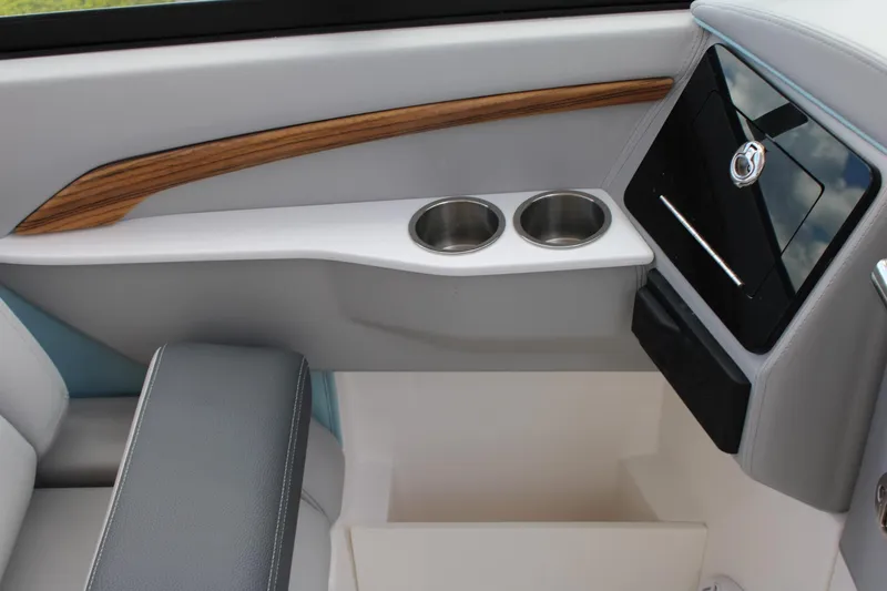 Slide: The Image of Interior of 2024 Regal LS9 Surf boat with cup holders and storage compartment. - 28