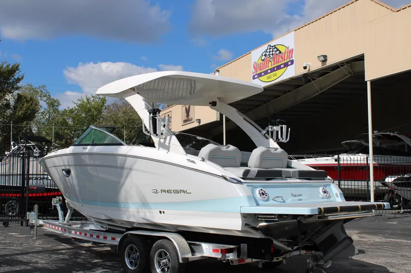 Slide: The Image of 2024 Regal LS9 Surf boat on trailer at South Austin Marine dealership. - 3