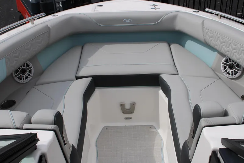 Slide: The Image of 2024 Regal LS9 Surf boat interior with cushioned seating and built-in speakers. - 35