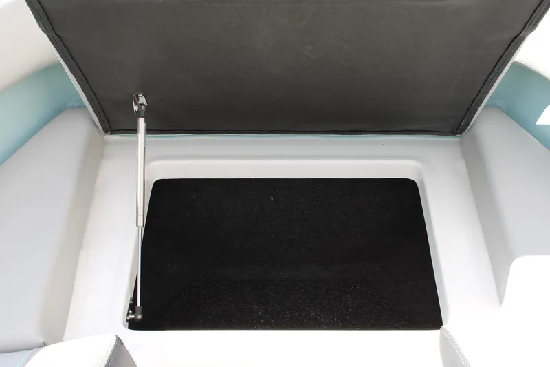 Slide: The Image of 2024 Regal LS9 Surf boat storage compartment with open lid. - 37