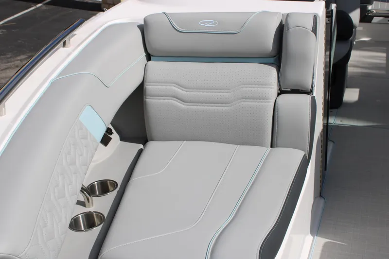 Slide: The Image of 2024 Regal LS9 Surf boat interior with luxurious gray seating and cup holders. - 38