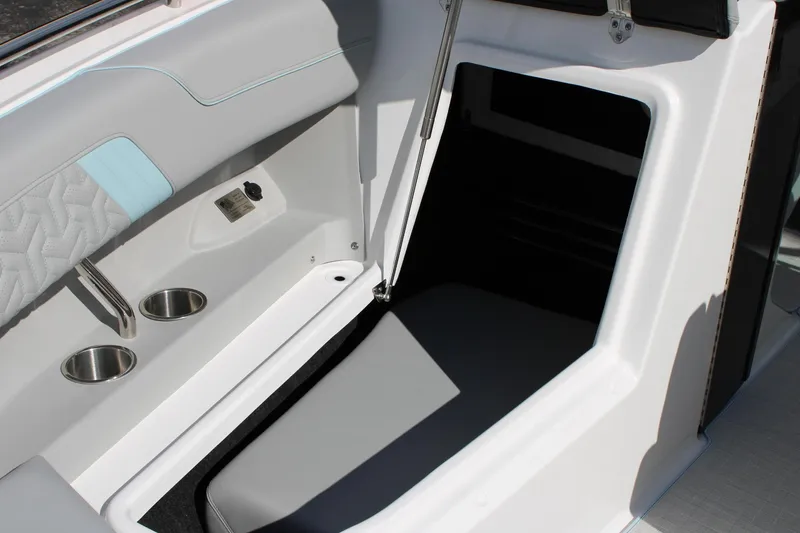 Slide: The Image of 2024 Regal LS9 Surf boat interior with seating and cup holders. - 39