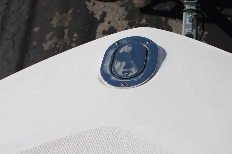 Slide: The Image of Close-up of 2024 Regal LS9 Surf boat deck with a chrome hatch. - 43