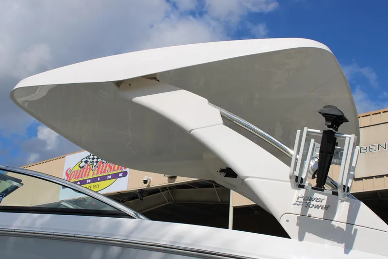 Slide: The Image of 2024 Regal LS9 Surf boat with Power Tower against blue sky. - 7