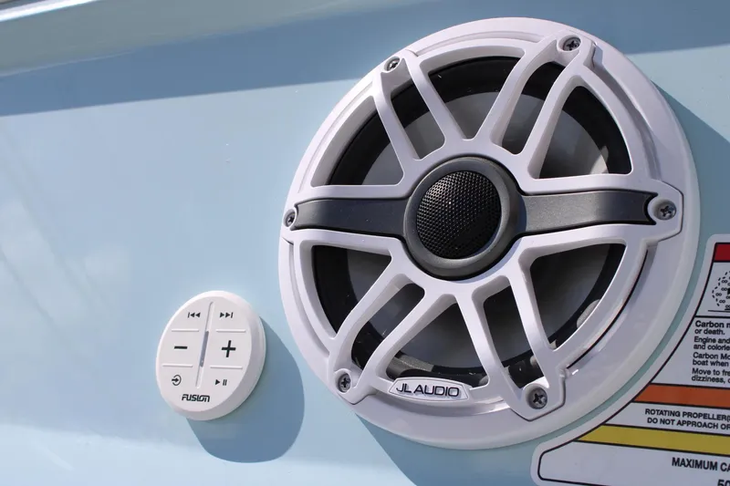 Slide: The Image of Close-up of JL Audio speaker and Fusion control panel on 2024 Regal LS9 Surf boat. - 9