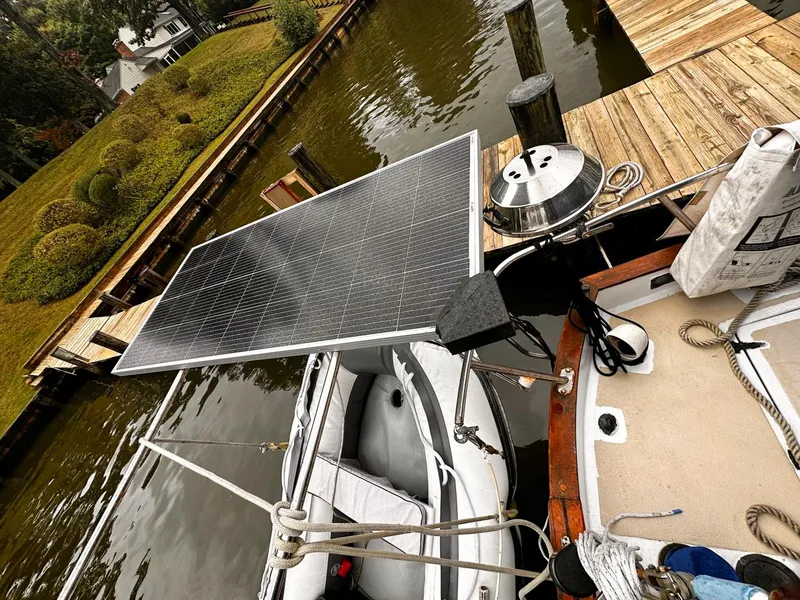 Slide: The Image of Solar panel on a 1976 Downeast 38 boat docked by a wooden pier. - 14
