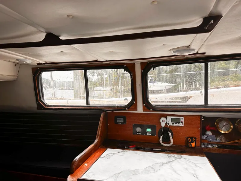 Slide: The Image of Interior of a 1976 Downeast 38 boat with a view of the control panel and windows. - 19