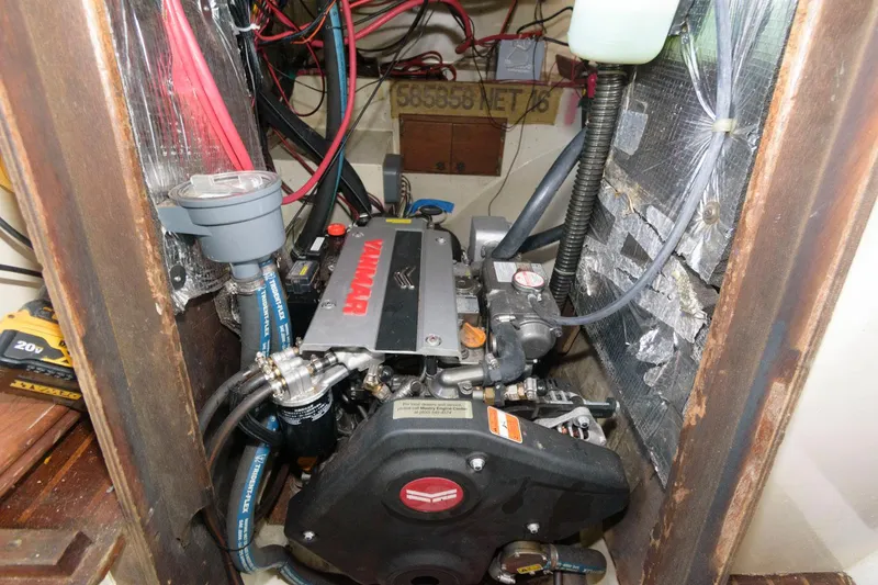 Slide: The Image of 1976 Downeast 38 engine compartment with Yanmar diesel engine. - 24
